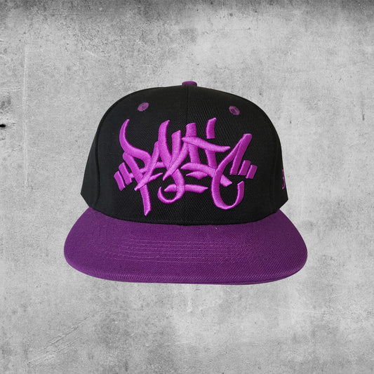 Panic 39 jungle/drum and bass branded snap back hat in black with purple puff embroidery.