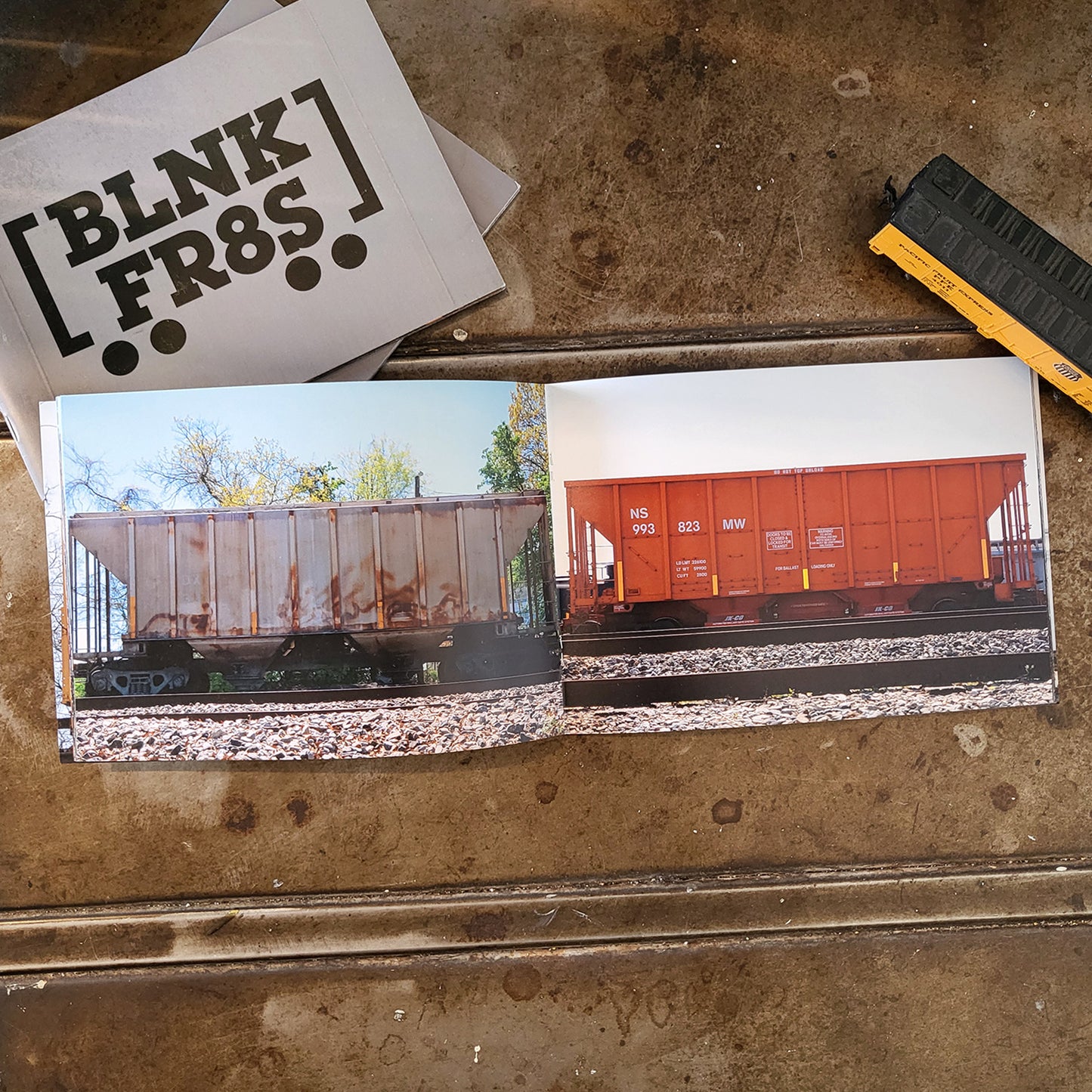 BLNK FR8S open book page of 2 train cars in color.