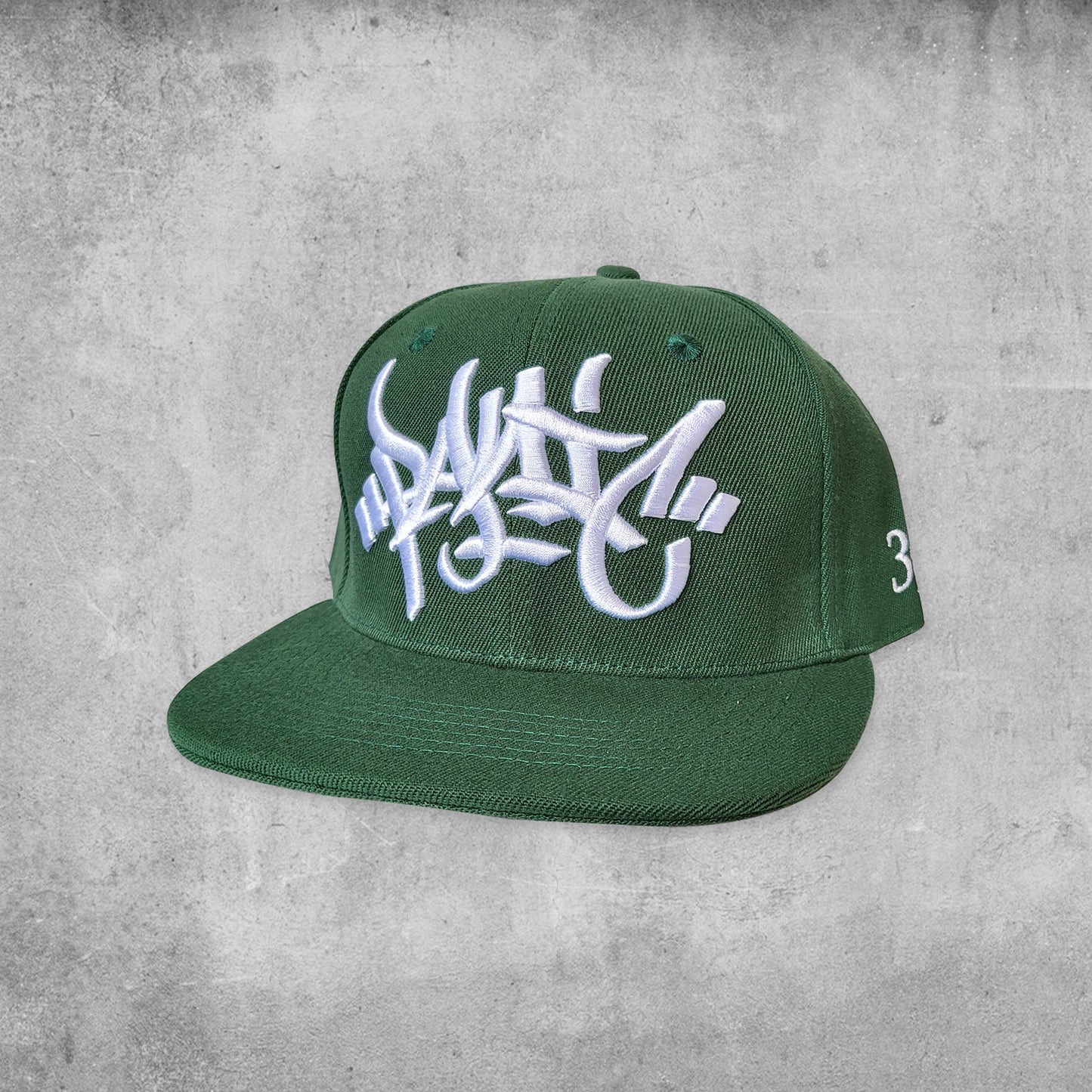 Panic 39 branded snap back hat in green with white puff embroidery.