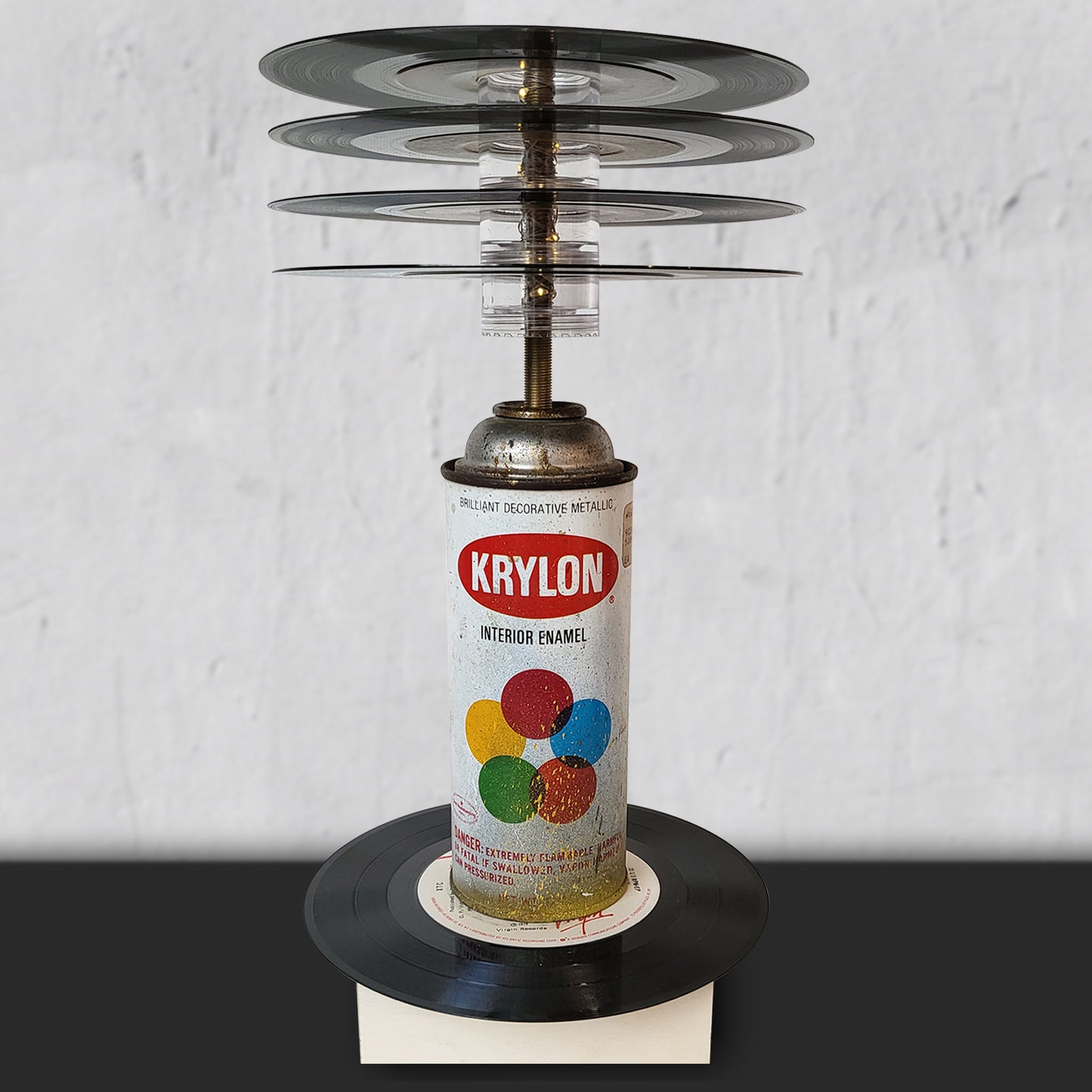 Decorative LED table lamp with 45 vinyl records and empy vintage krylon can