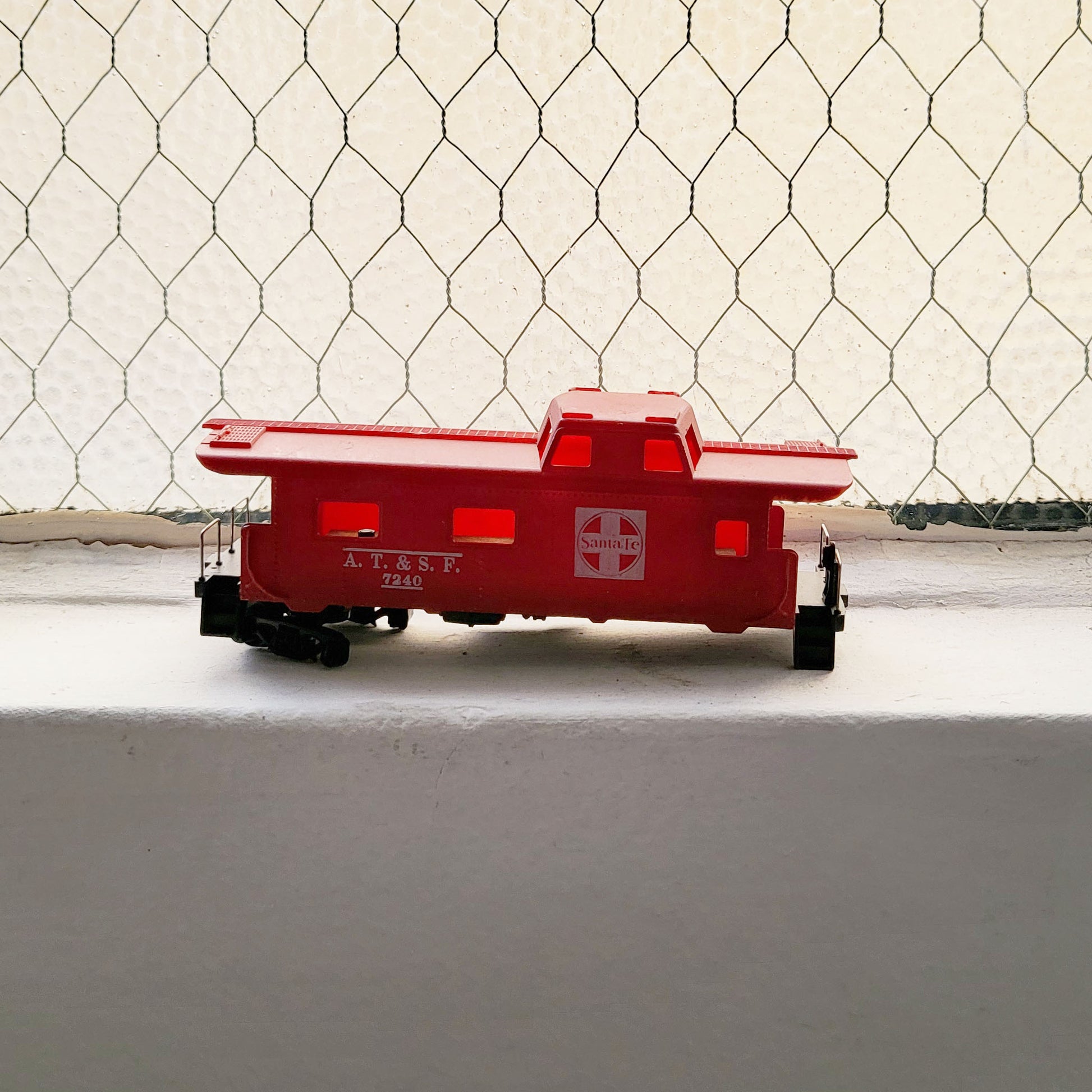 HO model toy 'Santa Fe AT&SF 7240' train caboose for graffiti writer gifts and train enthusiasts. 