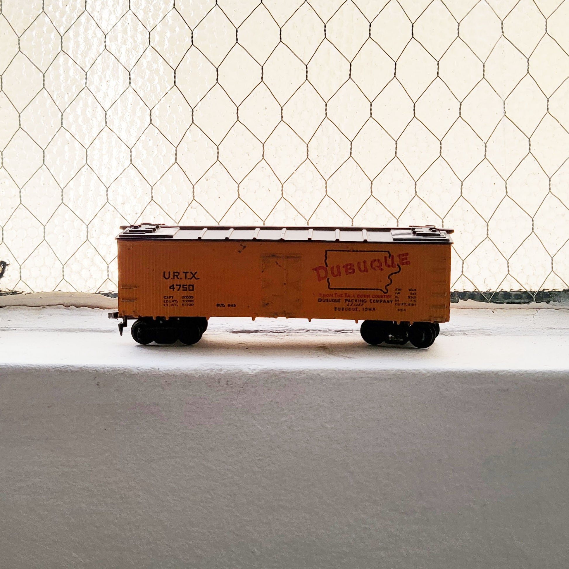 HO model toy 'Dubuque' train boxcar for graffiti writer gifts and train enthusiasts. 