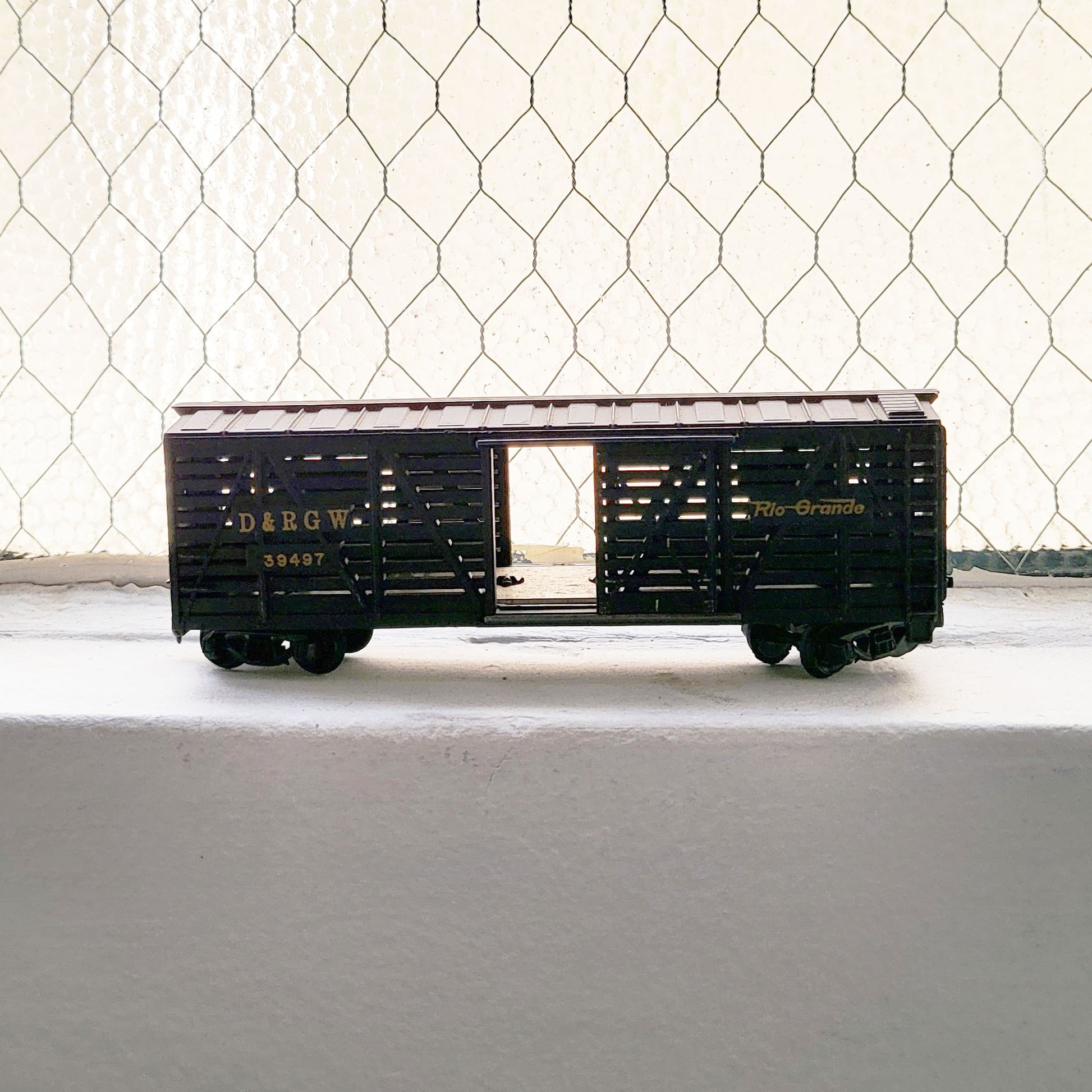 HO model toy 'Rio Grande' train cattle car for graffiti writer gifts and train enthusiasts. 