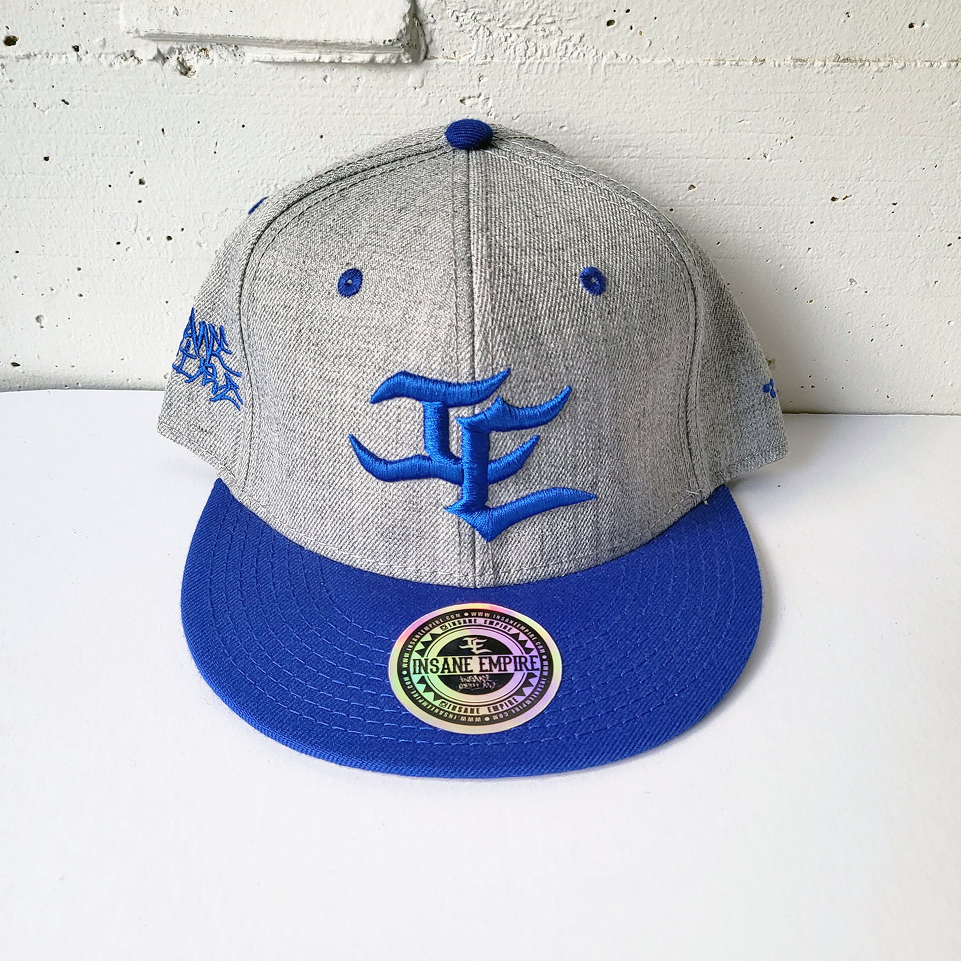 Local graffiti artist clothing brand inland empire blue on grey snap back hat