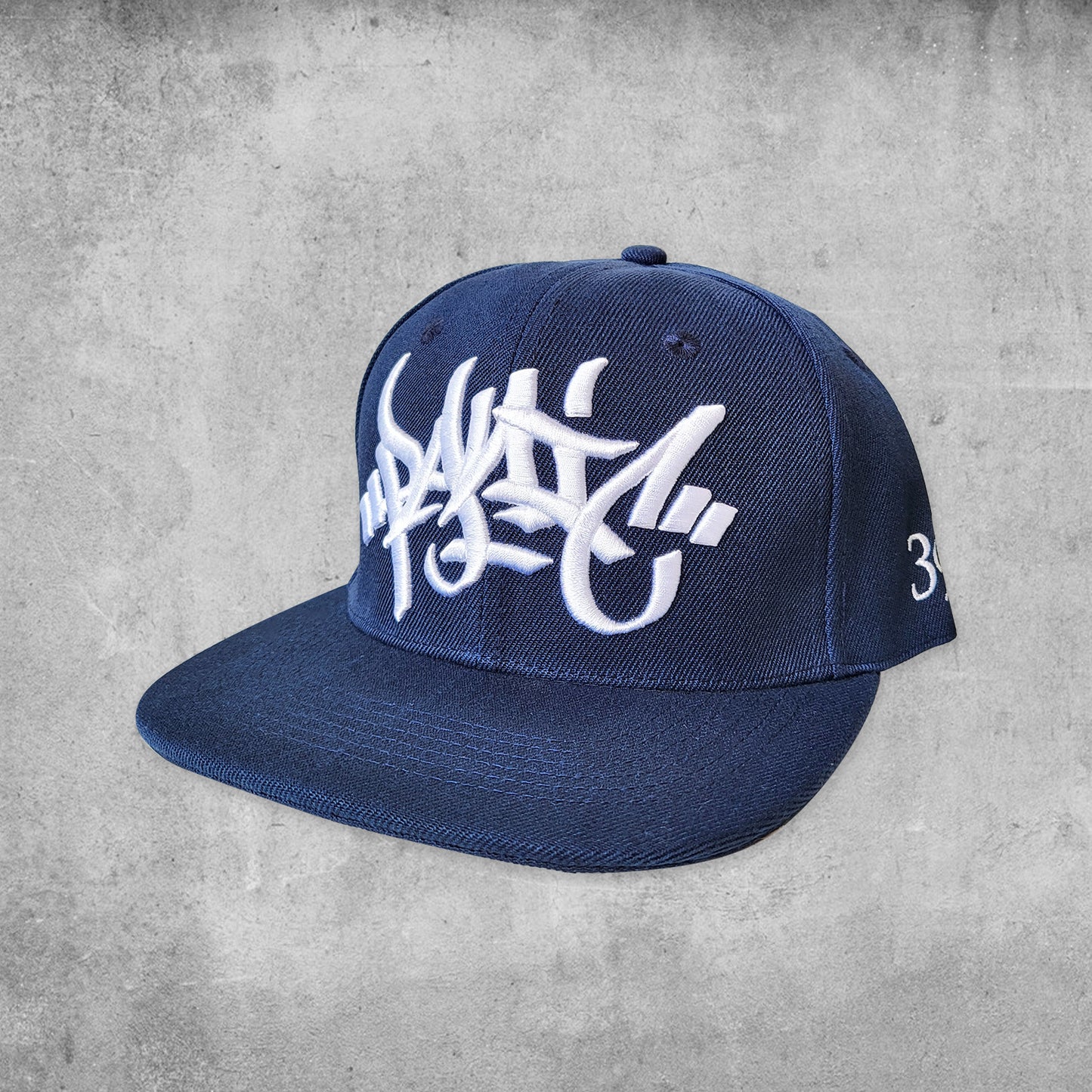 Panic 39 branded snap back hat in navy with white puff embroidery.