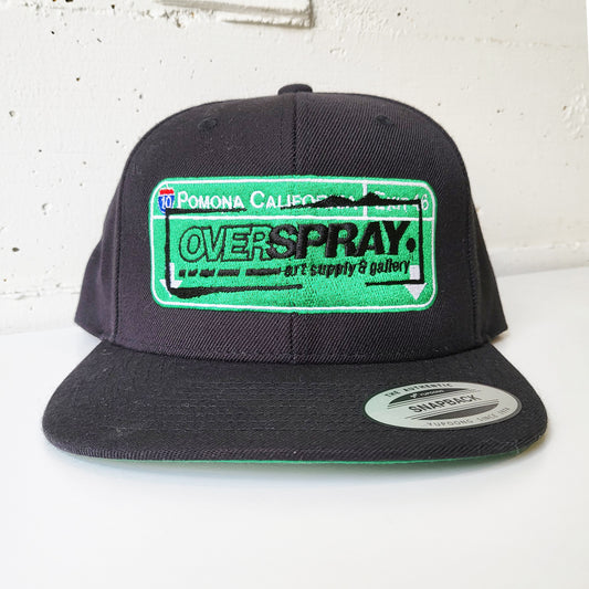 Overspray graffiti art supply shop branded snap back hat, freeway sign heaven.