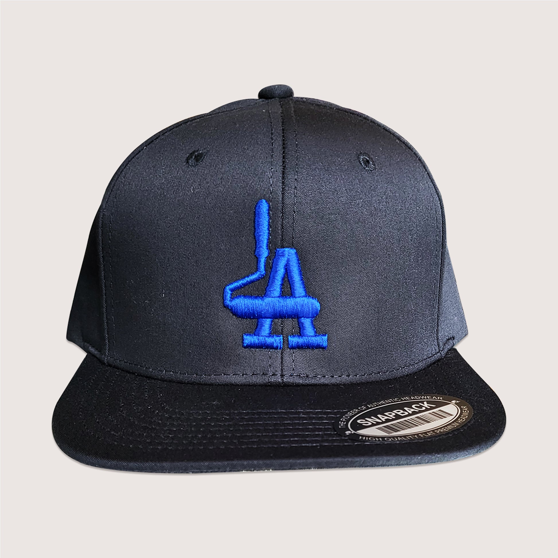 Phatcaps graffiti brand black baseball cap paint roller LA with blue embroidery.