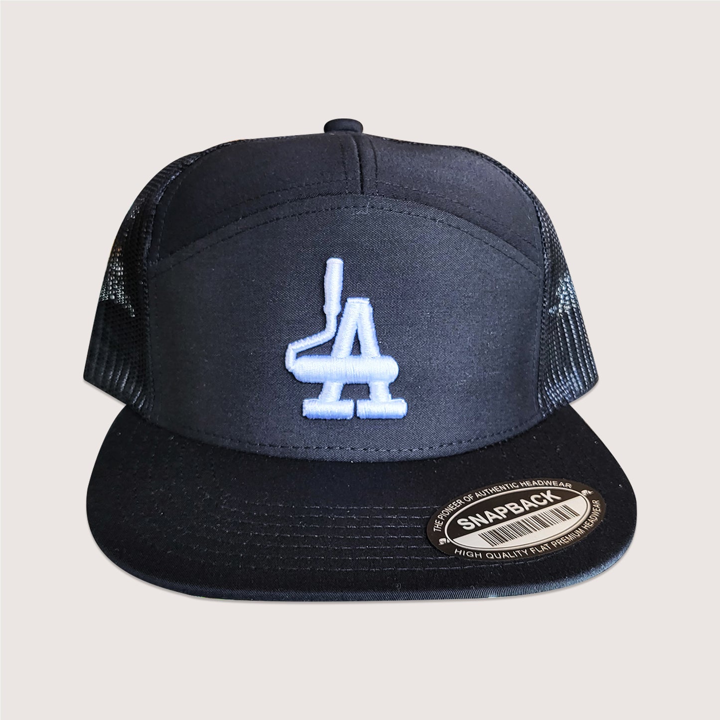 Phatcaps graffiti brand paint roller LA 7 panel trucker cap in black.