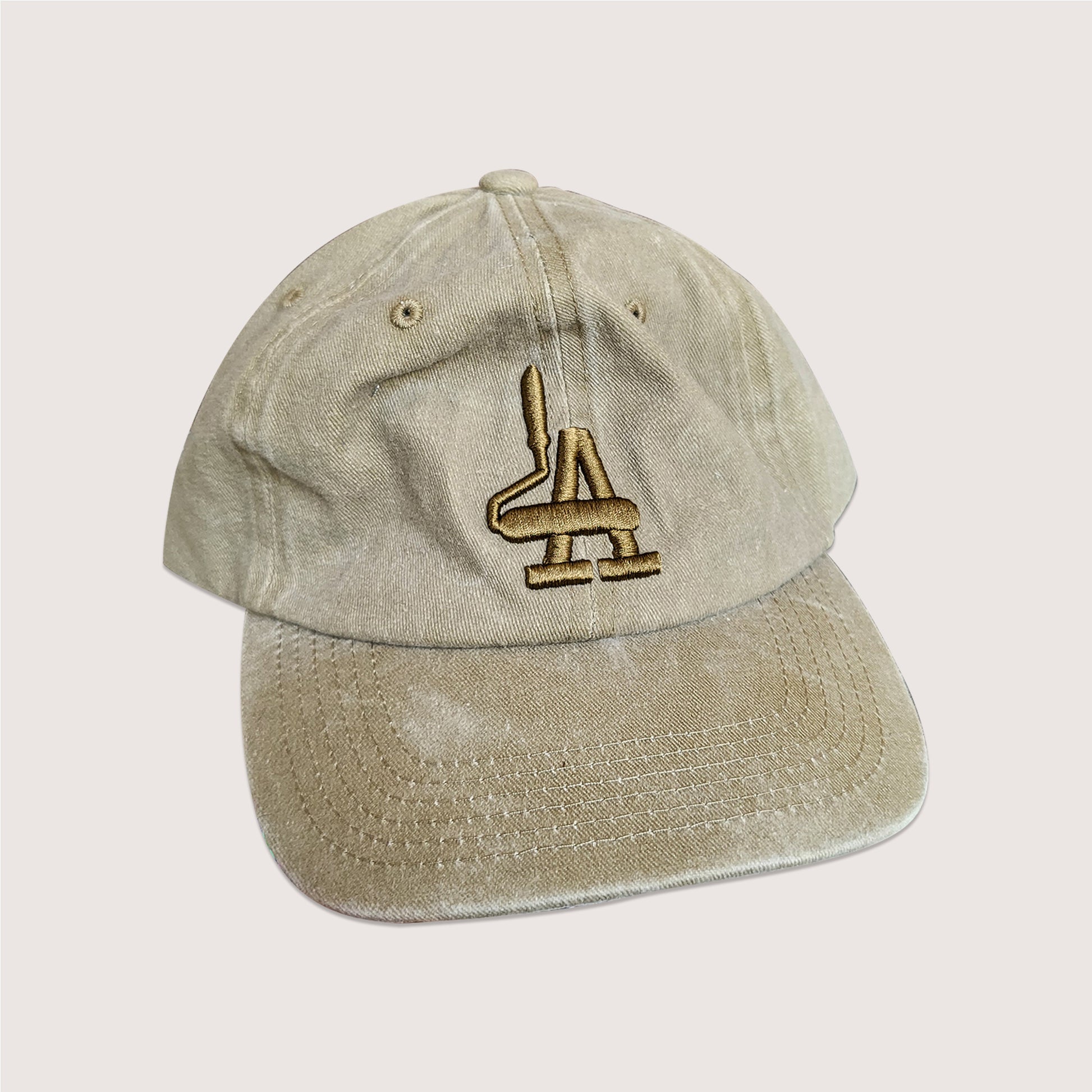 Locally branded unstructured cap in khaki brown with white puff embroidery detail.